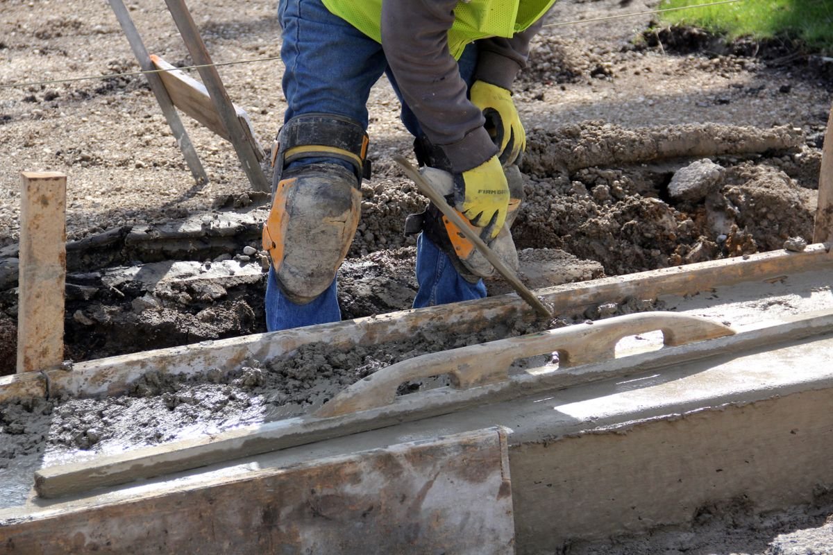 Lonestar Construction crew on a Houston job site finishing a residential driveway